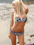 Kimber on the beach Horny TS posing her large juicy boobs. 